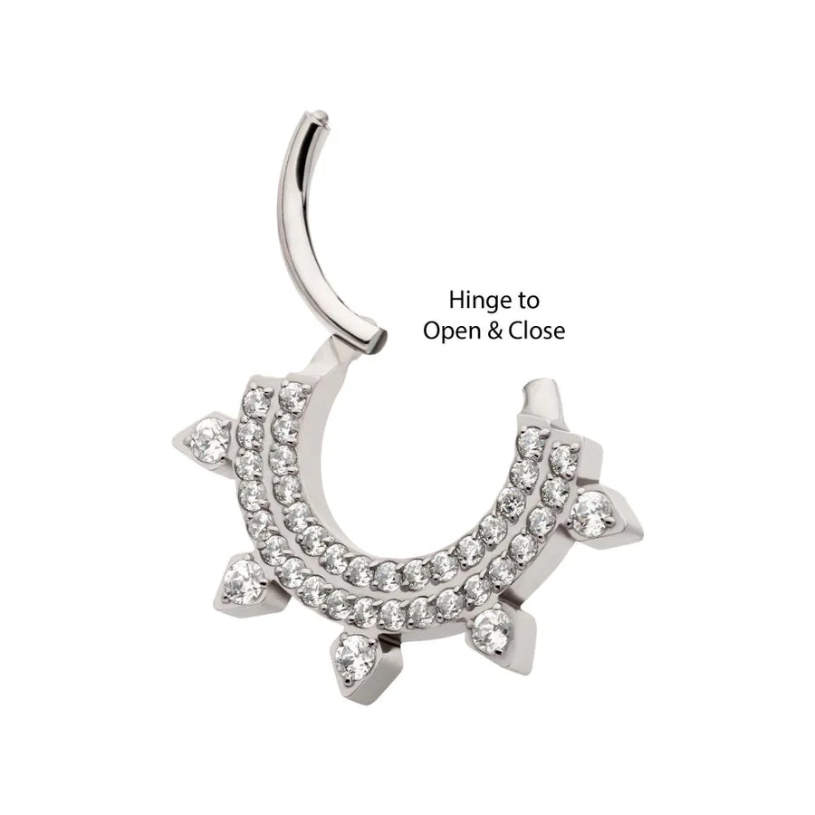 A high-quality silver or titanium hinged septum clicker featuring two rows of pavé-set clear crystals and five small crystal-encrusted spikes along the outer edge, shown in an open position.