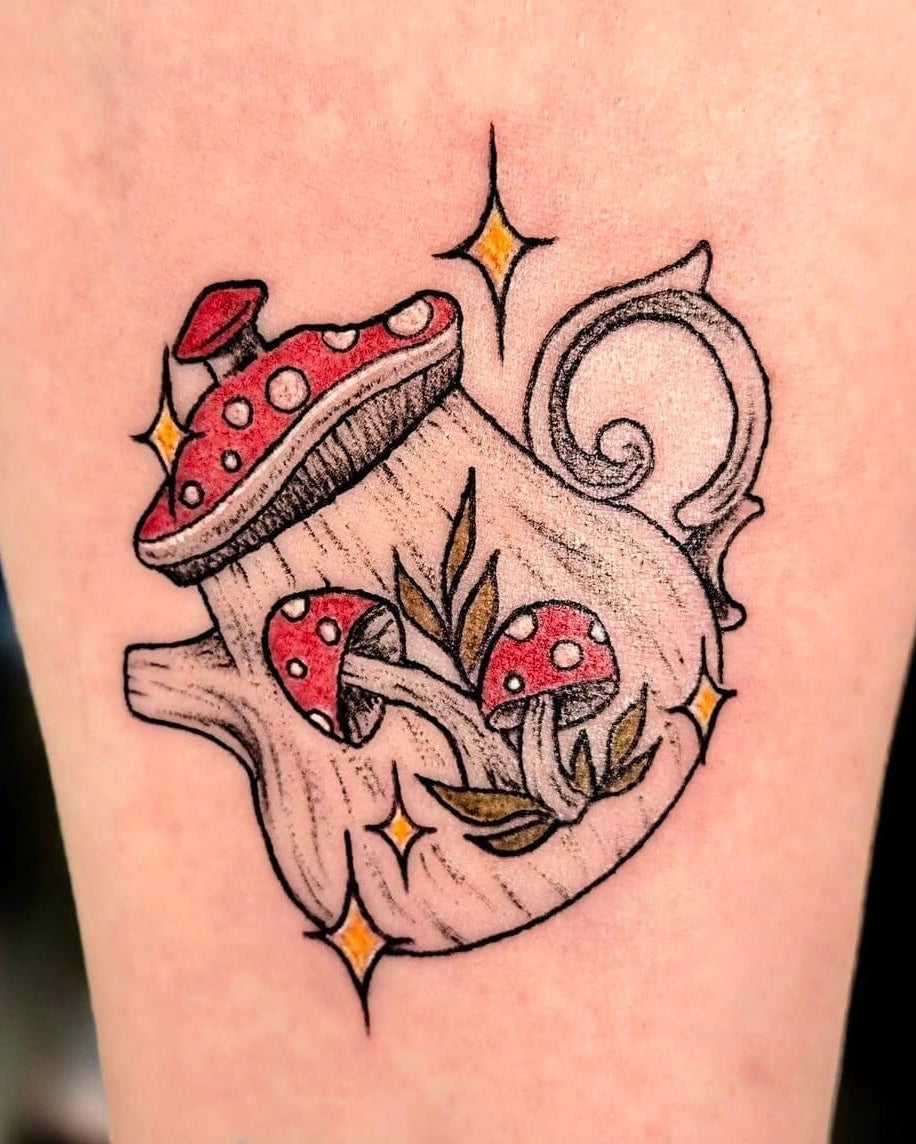 Tattoo of red mushrooms and a teapot on a person's arm.
