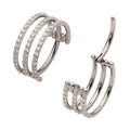 A high-quality silver or titanium triple-stacked septum clicker jewelry piece, featuring three parallel rows of pavé-set clear crystals, shown both closed and in an open hinged position.